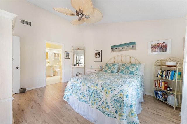 5618 Monte Rosso Rd, Sarasota, FL 34243 - bedroom with connected bathroom, light hardwood / wood-style floors, and ceiling fan