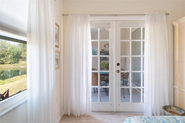 5618 Monte Rosso Rd, Sarasota, FL 34243 - doorway featuring french doors and light hardwood / wood-style flooring