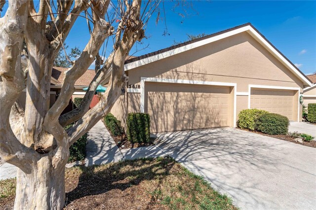 5618 Monte Rosso Rd, Sarasota, FL 34243 - view of front of property featuring a garage