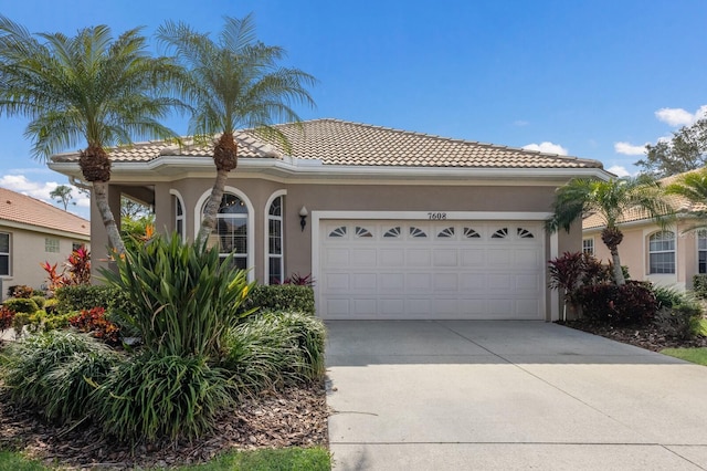 mediterranean / spanish house featuring a garage