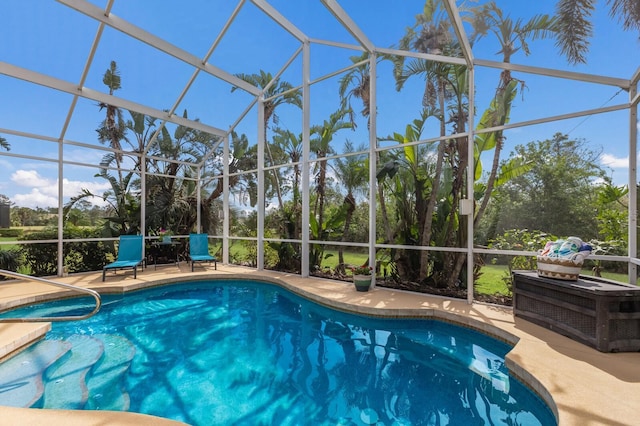 view of pool with a lanai and a patio area