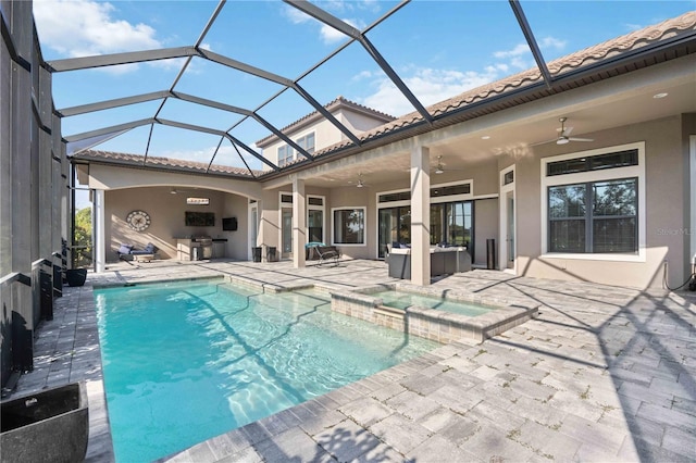 view of pool featuring a patio, an outdoor hangout area, an in ground hot tub, glass enclosure, and ceiling fan