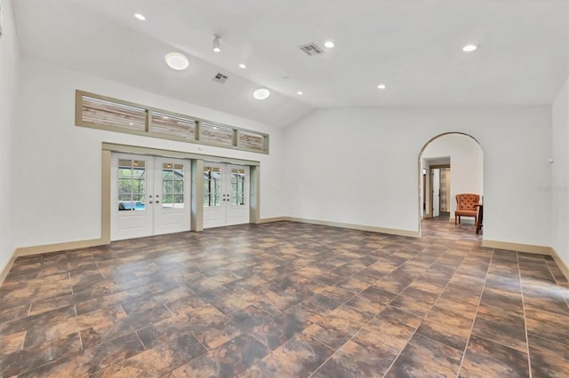 spare room featuring visible vents, high vaulted ceiling, french doors, and baseboards