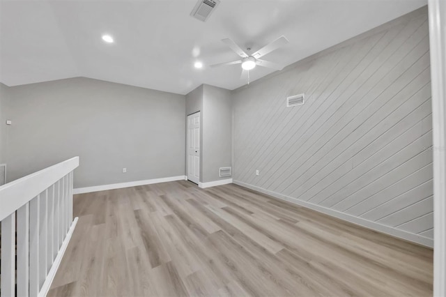 spare room with visible vents, light wood-style flooring, and baseboards
