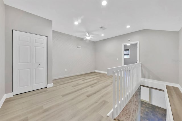 empty room with ceiling fan, visible vents, baseboards, recessed lighting, and wood finished floors