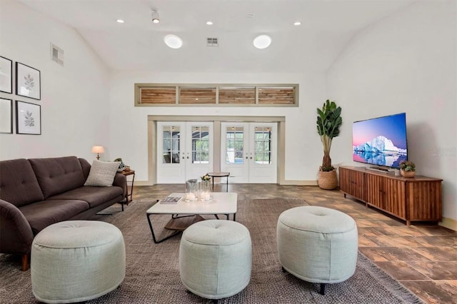 living room featuring french doors, visible vents, and baseboards