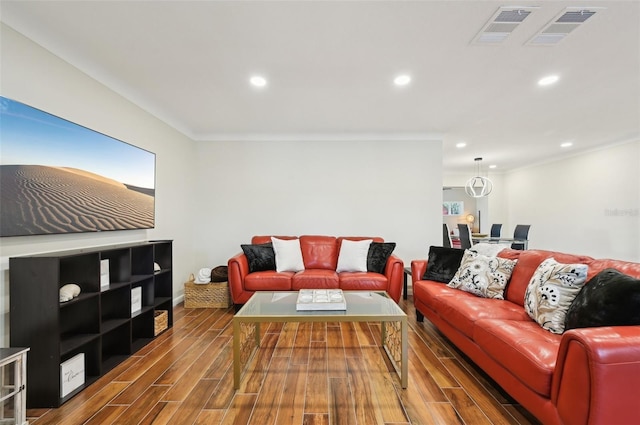 living room with ornamental molding and dark wood-type flooring