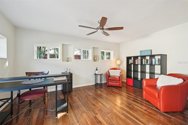 game room with ceiling fan and dark hardwood / wood-style flooring