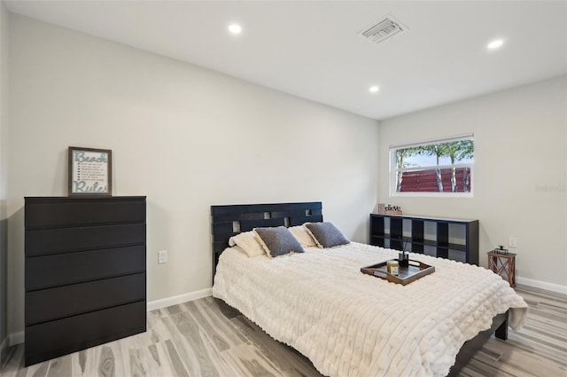 bedroom with light hardwood / wood-style floors