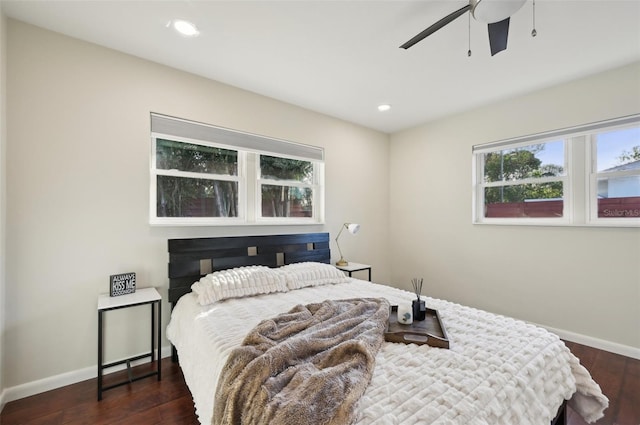 bedroom featuring ceiling fan and dark hardwood / wood-style flooring