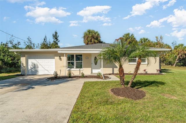 ranch-style house featuring a front lawn and a garage