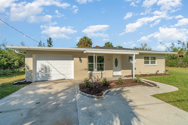 single story home with a front lawn and a garage