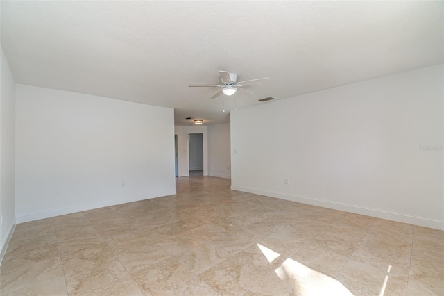 unfurnished room with ceiling fan