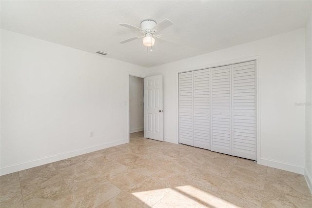 unfurnished bedroom with a closet and ceiling fan