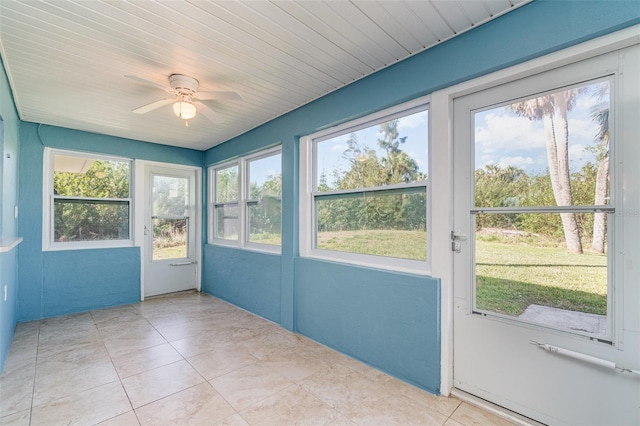 unfurnished sunroom with ceiling fan and wooden ceiling