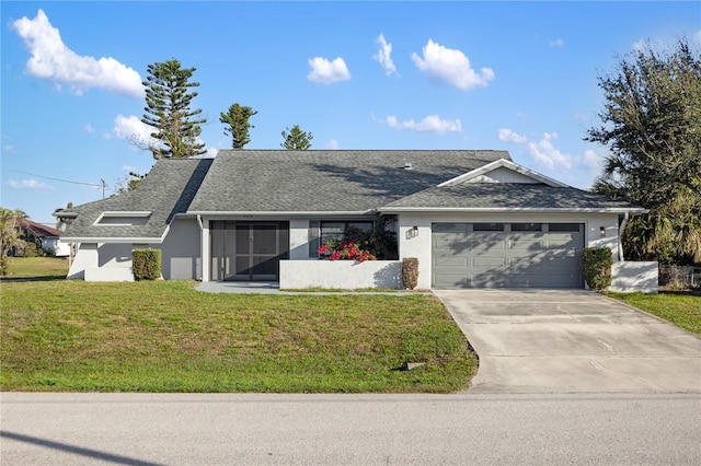 ranch-style home with a garage and a front lawn