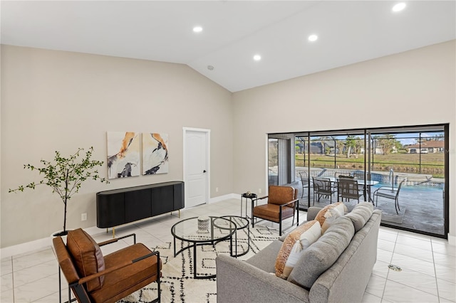 living room with high vaulted ceiling