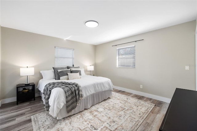 bedroom featuring wood-type flooring