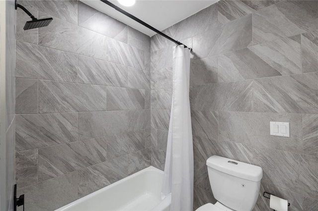 bathroom with shower / bath combination with curtain and toilet