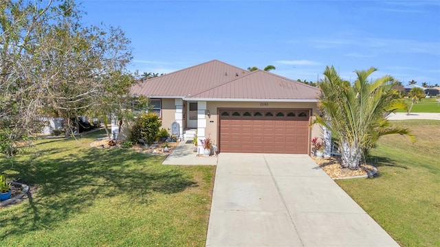 ranch-style house with a garage and a front lawn