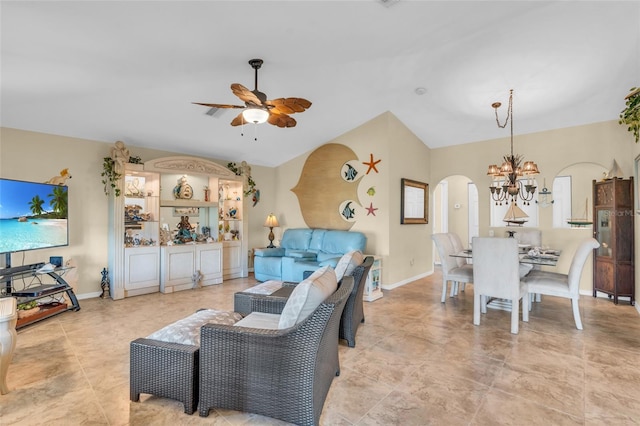 living room featuring ceiling fan with notable chandelier and vaulted ceiling