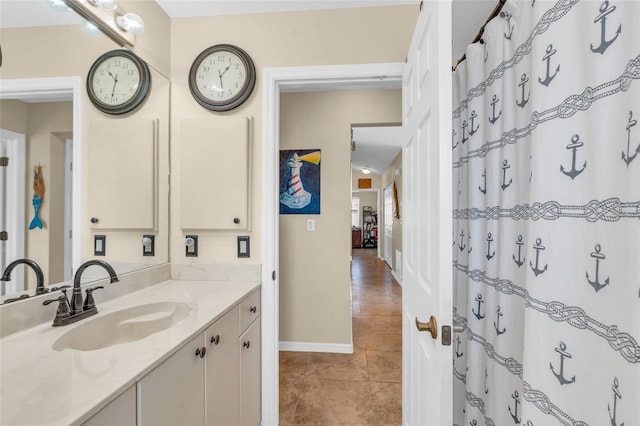 bathroom featuring tile patterned flooring, vanity, and a shower with shower curtain