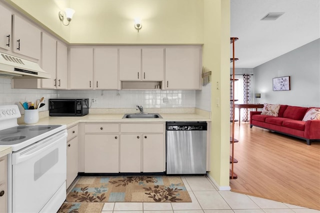 kitchen with electric range, stainless steel dishwasher, a sink, black microwave, and under cabinet range hood