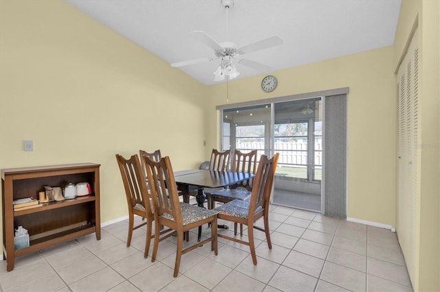 dining space featuring light tile patterned floors, ceiling fan, and baseboards