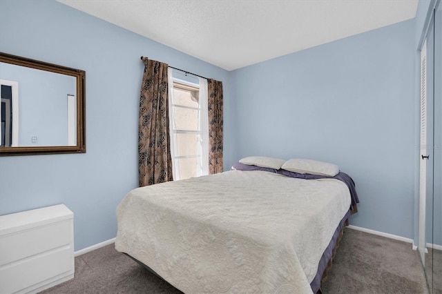 bedroom featuring carpet and baseboards