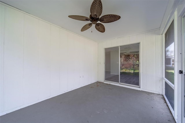 unfurnished sunroom with ceiling fan