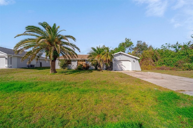 view of front of home featuring a garage and a front yard