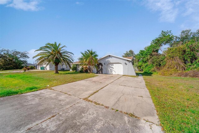 ranch-style house with a garage and a front yard