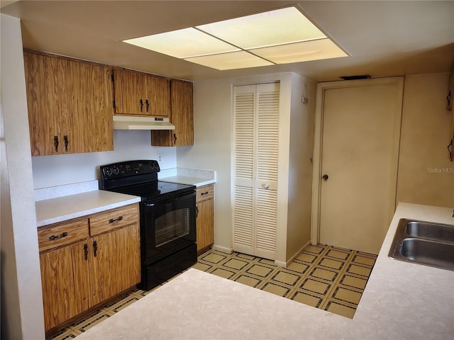 kitchen featuring sink and electric range