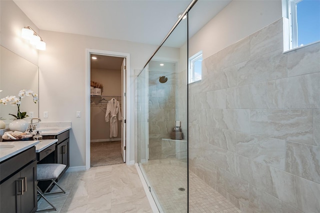 bathroom featuring vanity and tiled shower