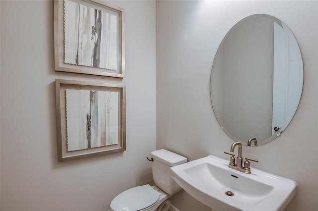 bathroom with sink and toilet