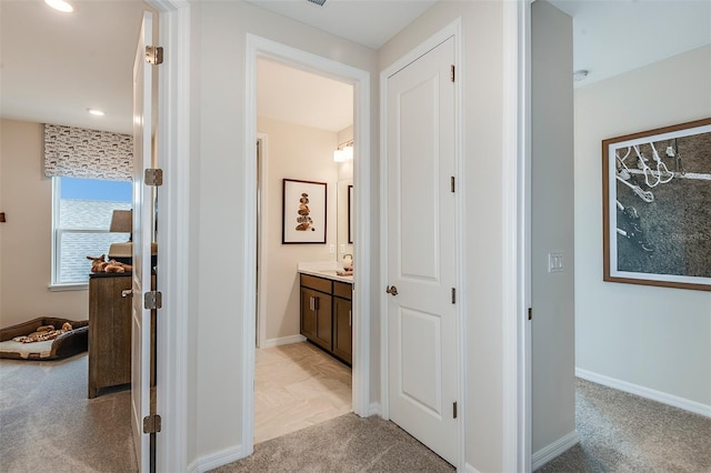 hallway with light carpet