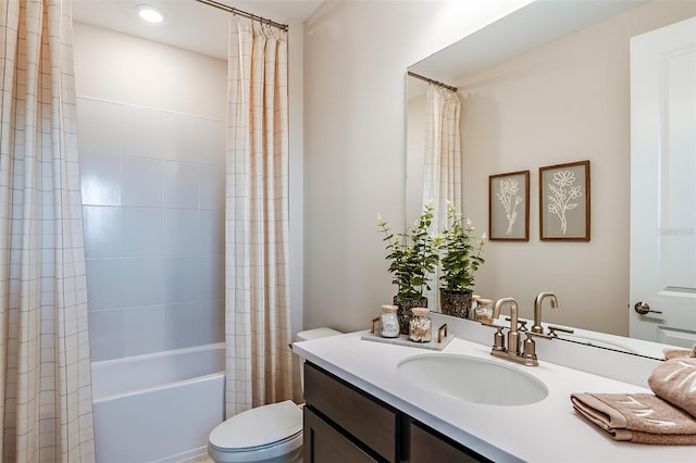 full bathroom featuring vanity, shower / bathtub combination with curtain, and toilet