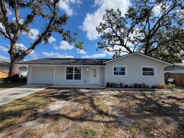 single story home featuring a garage