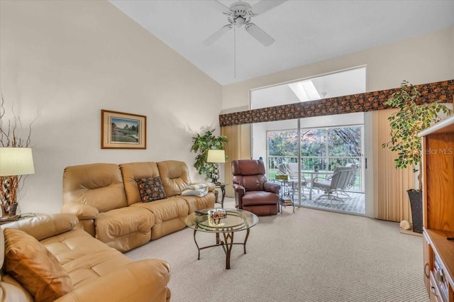 living room with ceiling fan, high vaulted ceiling, and carpet