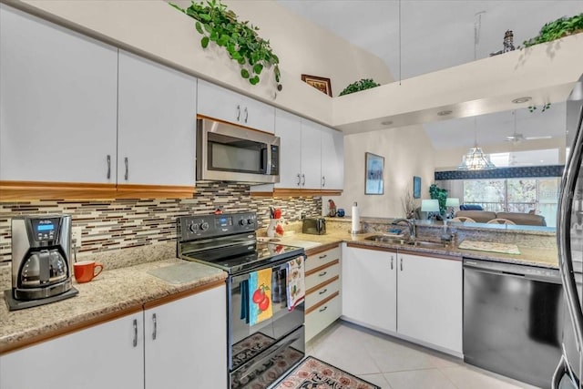 kitchen featuring white cabinets, sink, and black appliances