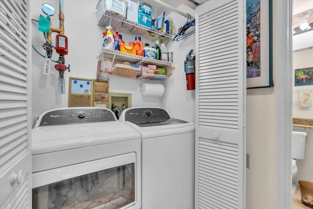 washroom with washer and dryer