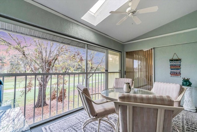 sunroom featuring ceiling fan and lofted ceiling with skylight