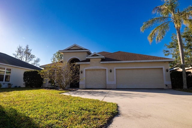 view of front of house featuring a garage and a front yard