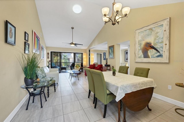 tiled dining area with ceiling fan with notable chandelier and high vaulted ceiling