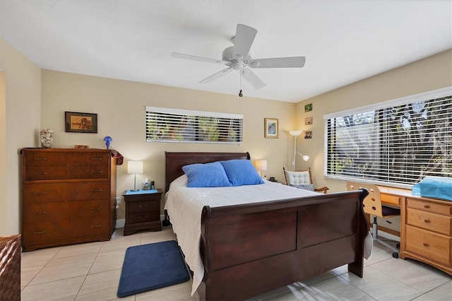 bedroom with ceiling fan and light tile patterned floors