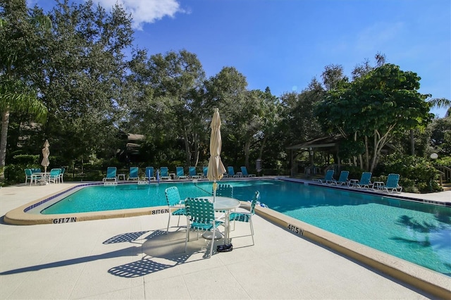 view of swimming pool with a gazebo and a patio area