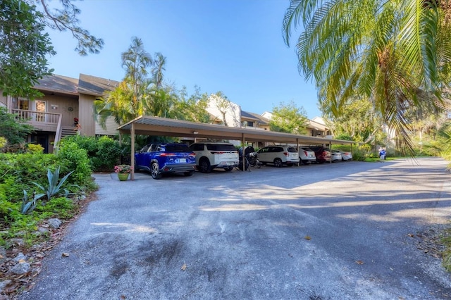 view of vehicle parking with a carport