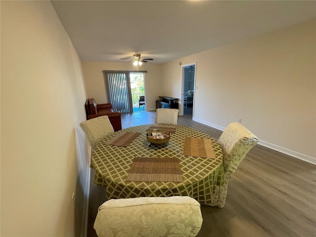 dining room featuring ceiling fan and dark hardwood / wood-style flooring