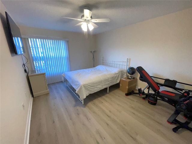 bedroom featuring ceiling fan and light wood-type flooring