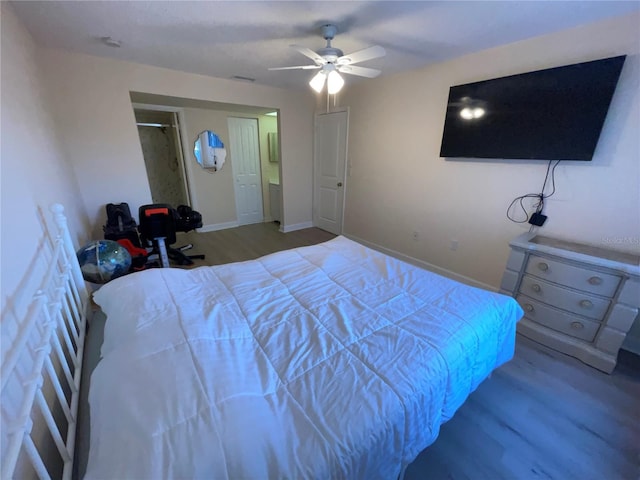 bedroom with wood-type flooring and ceiling fan